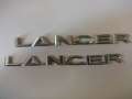 Эмблема на крышку багажника (логотип LANCER) 7415A112 Mitsubishi Lancer (CX,CY)