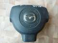 Накладка подушки безопасности на рулевое колесо D35057K00 DEMIO DY5W Mazda Demio (DY5W)